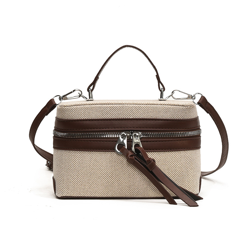 2025 nuevo nicho de diseño retro color contrastante empalme bolso de mano personalidad viaje elegante mochila de hombro