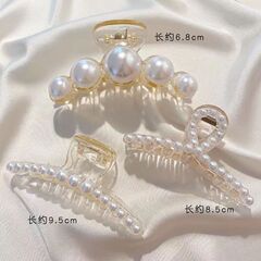 韓国の優雅な気質のサメのクリップの髪をつかみます。