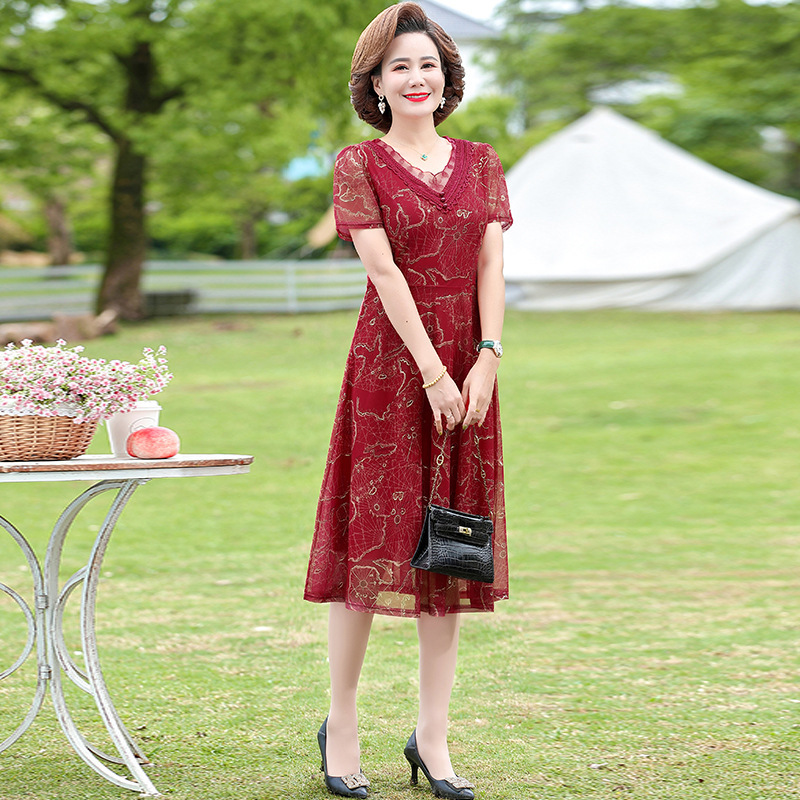 中年のお母さんの婦人服の半袖のワンピースの夏服の洋風の百塔の気質の大きいサイズの新型はやせている中高年のスカートを現します。|undefined