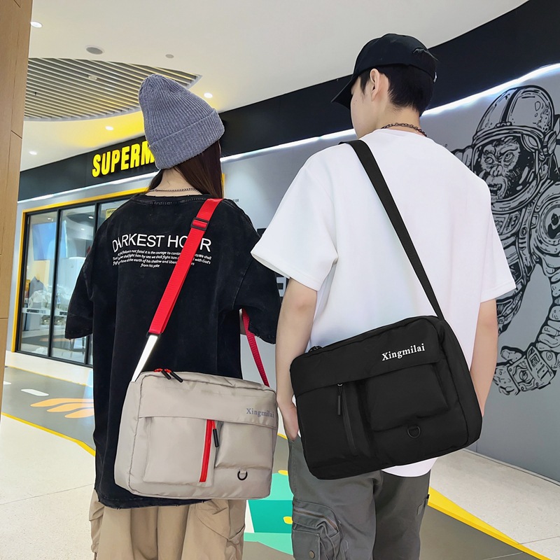 新款男女通用大容量工装包潮牌港风斜挎包男休闲街头潮流布包代发