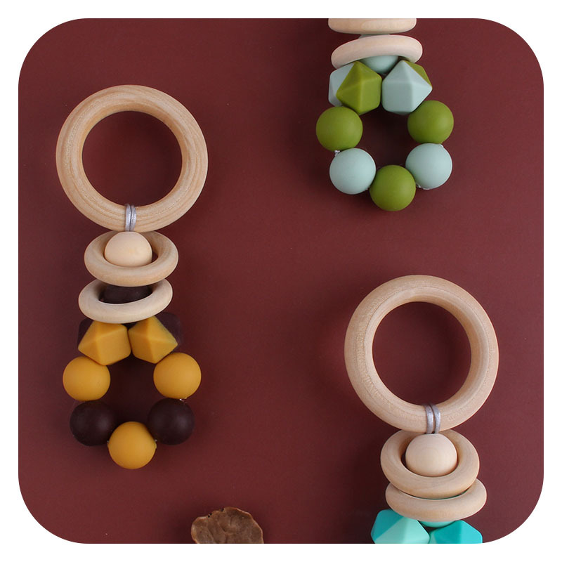 Nuevos suministros para bebés DIY creativo anillo de madera mordedor bebé calmante de dos colores de silicona de juguete dientes de molienda palo