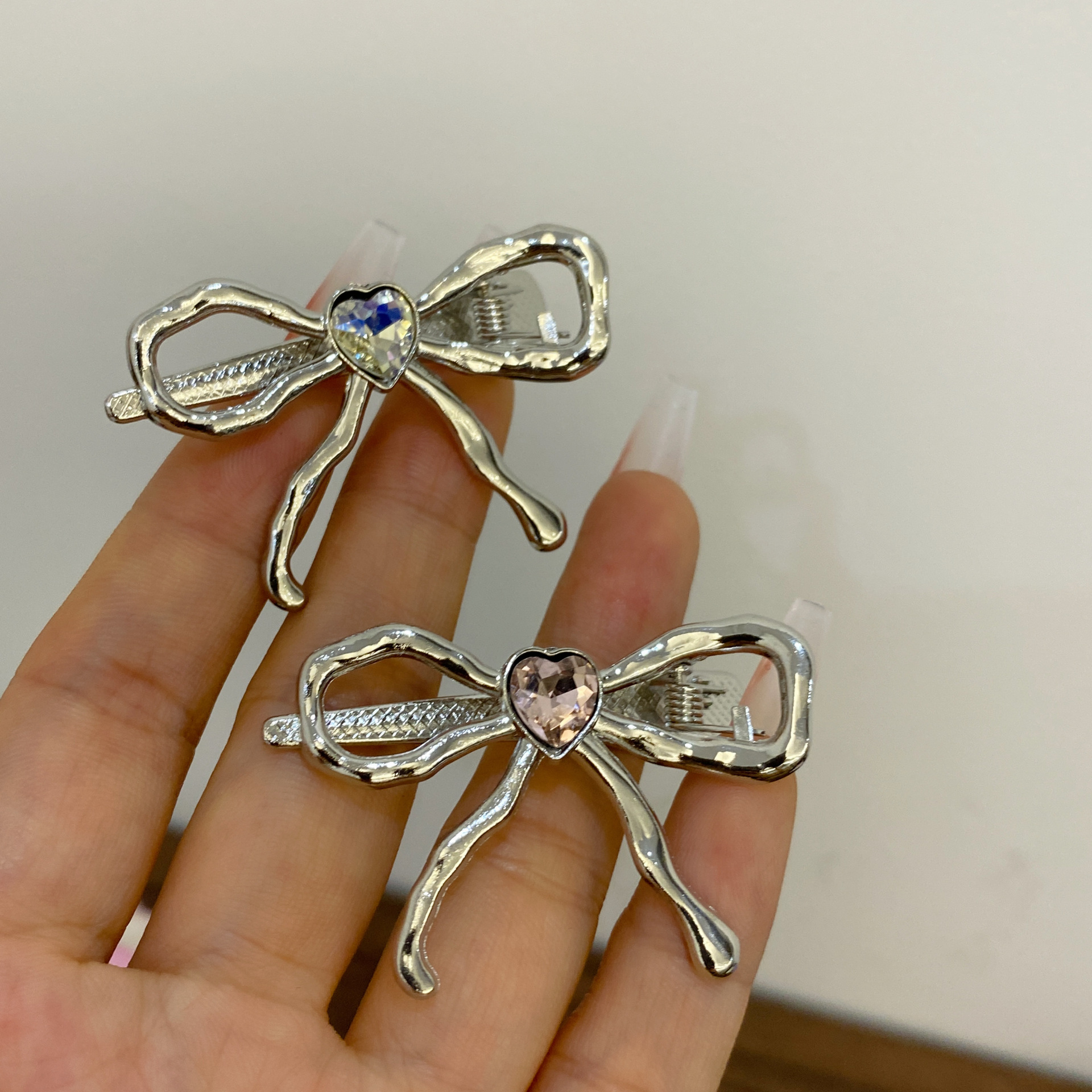 Fermaglio a fiocco in argento con strass per capelli da donna_voghion.com