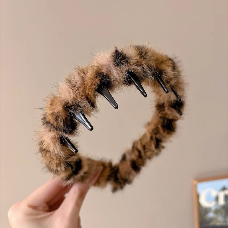 Temperamento coreano de leopardo ondulado banda de cabello mujer alta sensación de moda de presión de aire extranjera broca de cabello de peluche de otoño y invierno cabeza de cabeza alta