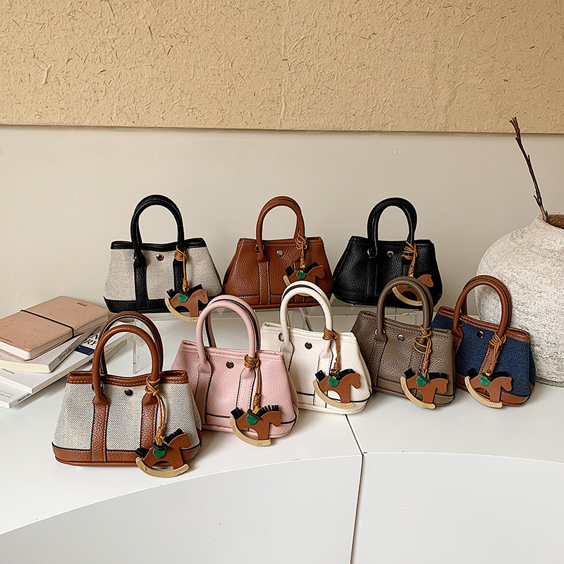 New Children's Bag with Retro Patchwork Design, Mini Baby Handbag with Rocking Horse Pendant, Compact and Lightweight, Unisex Shoulder Bag