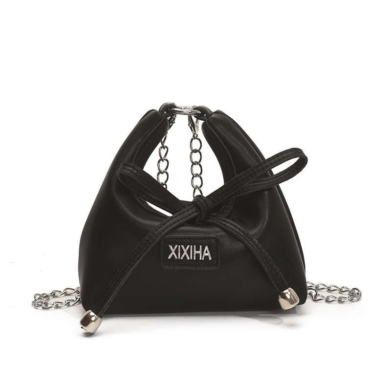 Bolsa de tendencia coreana para niñas, mini bolso de mano simple de color sólido, bolso de accesorios para niños de arco lindo