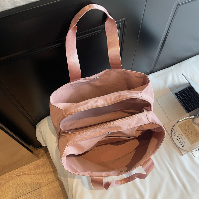 Nuevo tipo de tela casuales de mujer de hombro bolsa de viaje corto de gran capacidad de color sólido bolsa de equipaje ligero de mujer