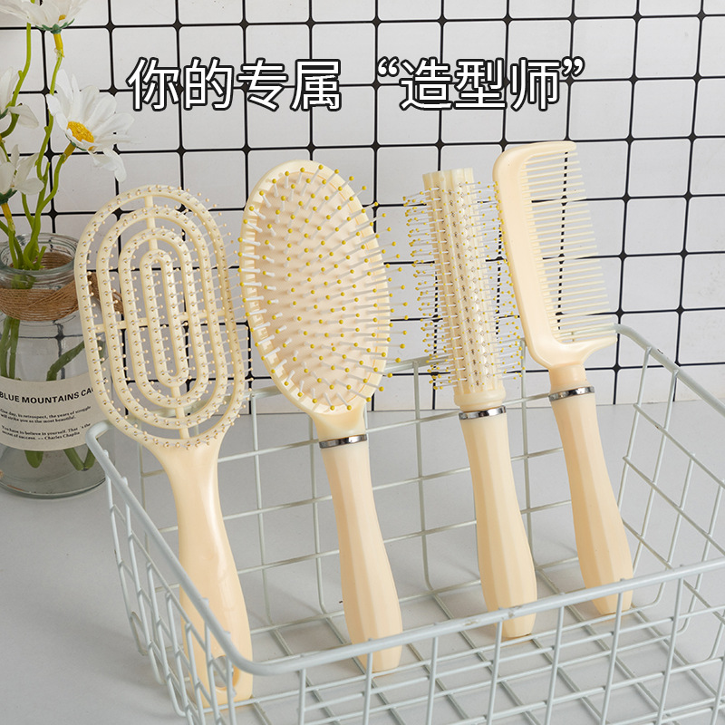 Peine de colchón de aire amarillo de 4 piezas Peine de costillas esponjosas Peine portátil de alto valor Peine suave para el cabello Peine de masaje doméstico