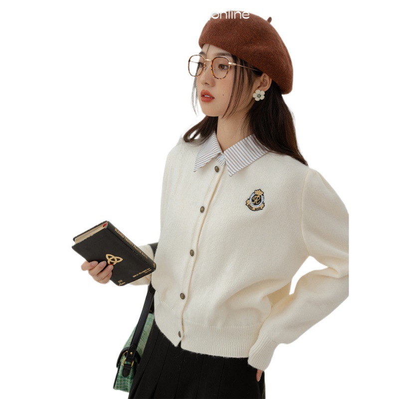 偽の2枚の学院風polo襟のカーディガンのセーターの女性秋冬のデザイン感の小さい人たちはニットのカーディガンを着ます。