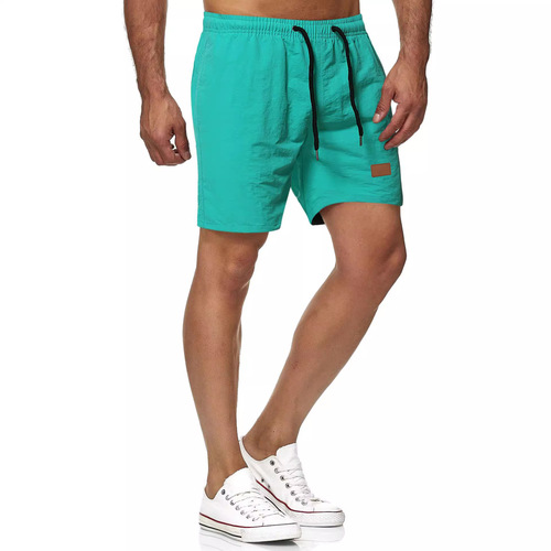 Men's all-matching five-minute quick-dry solid color leather label beach pants, sports fitness shorts
