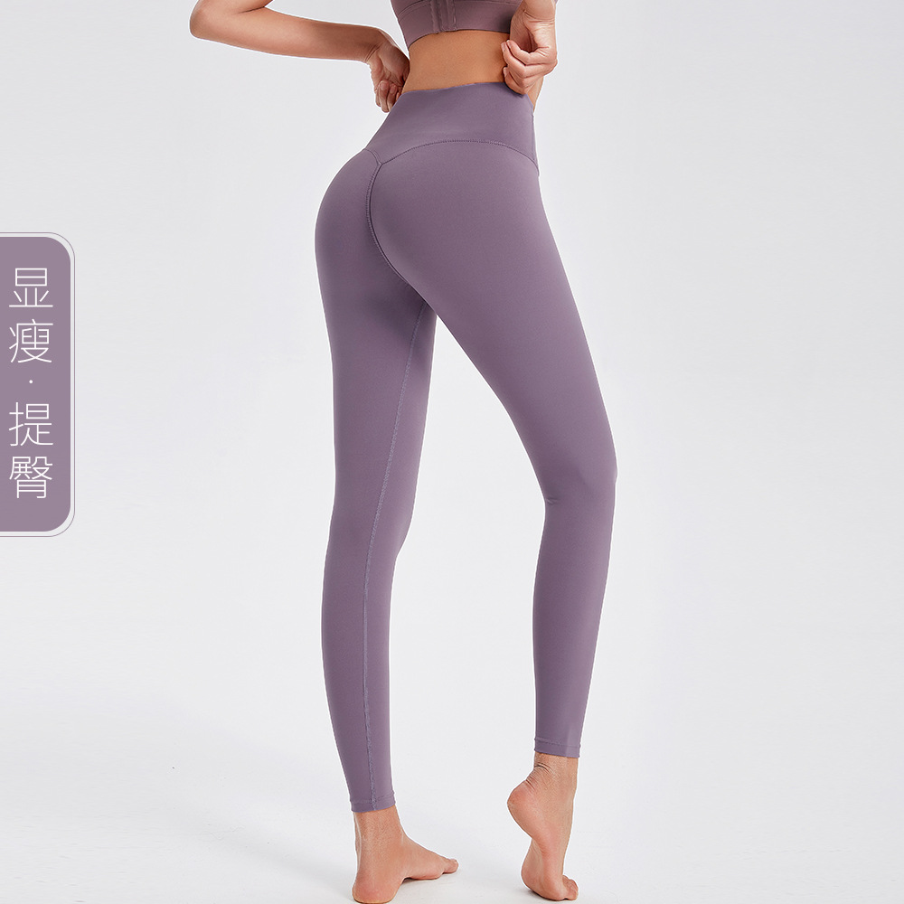 Pantalones de Yoga de contracción del vientre desnudo europeo y americano transfronterizo pantalones de fitness de cintura alta elásticos de las mujeres pantalones ajustados de elevación de la cadera corriendo pantalones de secado rápido