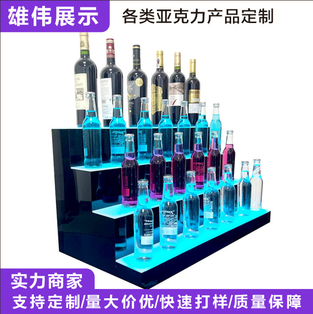 Acrylic smart illuminated wine rack with dynamic lighting effects, featuring a four-tiered stepped display stand