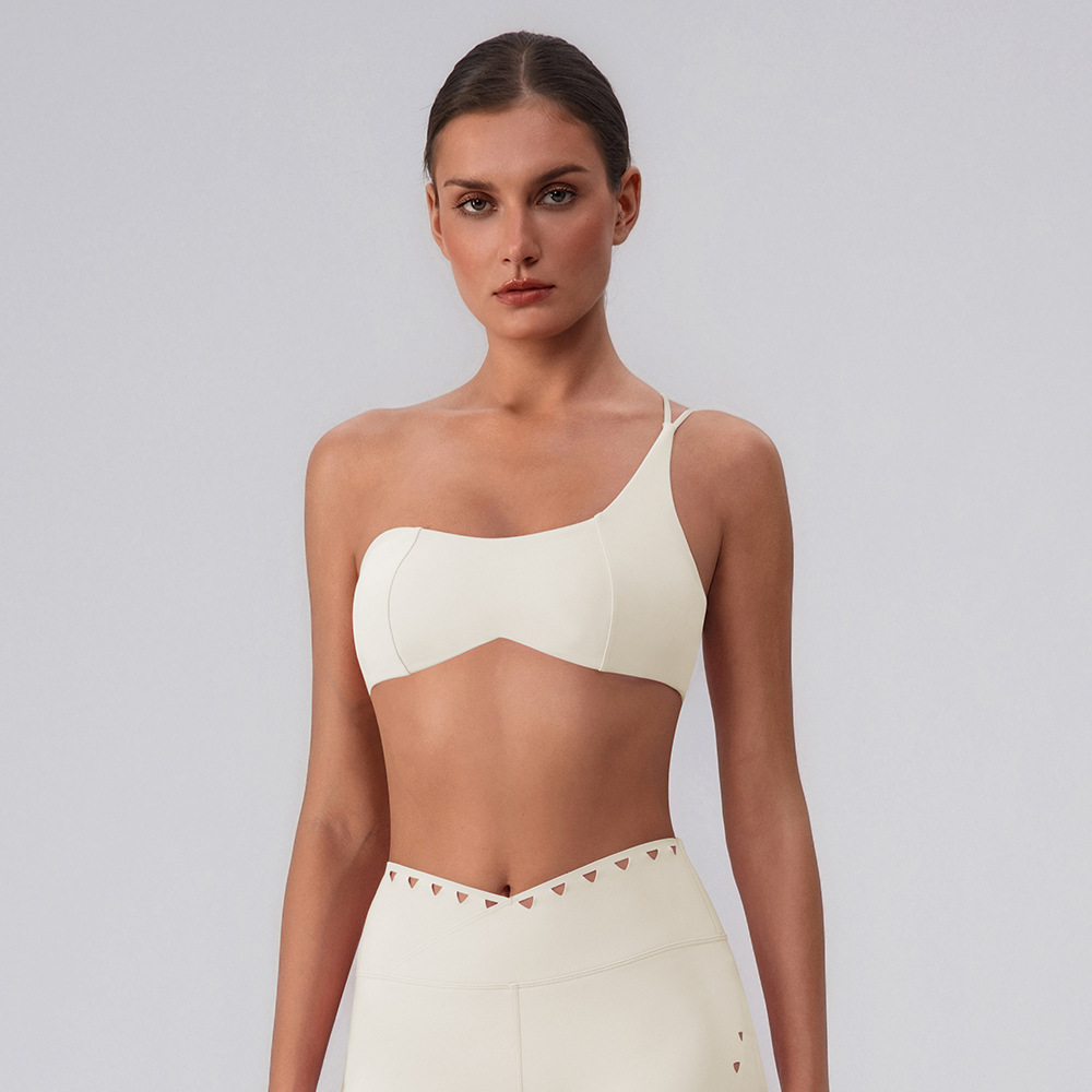 Sujetador de yoga hueco europeo y americano, almohadilla para el pecho desmontable de secado rápido, ropa interior deportiva, ropa de fitness Pilates, top de un hombro para mujer