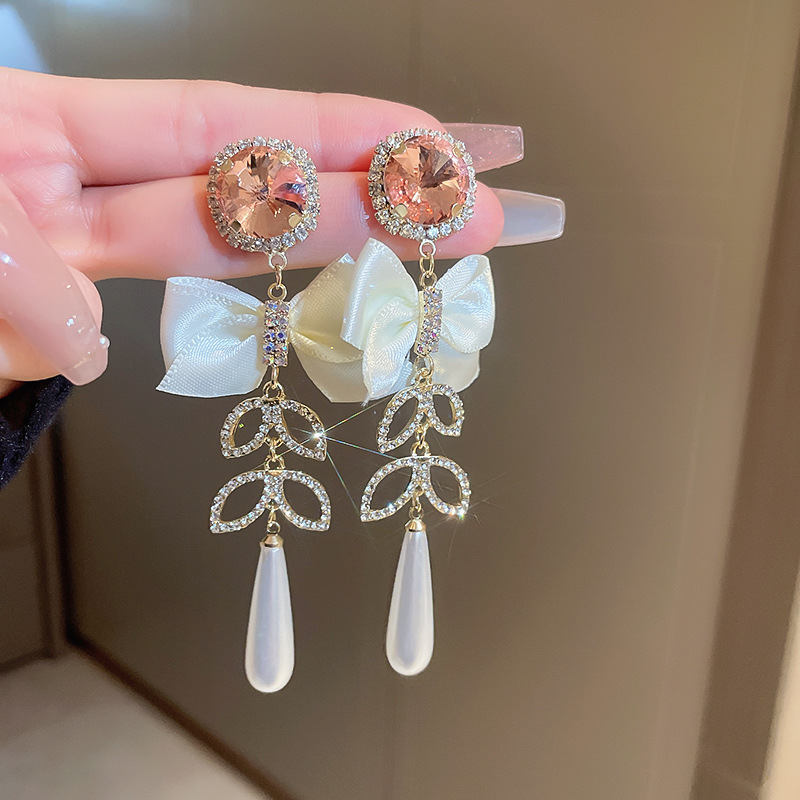 Pendientes de borla de flores de hilo de malla de perlas de aguja de plata Pendientes frescos y dulces de primavera y verano Pendientes de moda de deseo puro de súper hada al por mayor