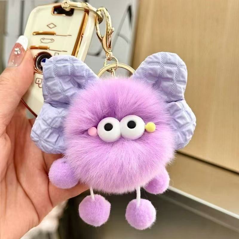 Nuevo estilo creativo imitación piel de conejo celebridad de Internet bowknot pequeña bola de carbón colgante niña corazón mochila escolar decoración coche llavero mujer
