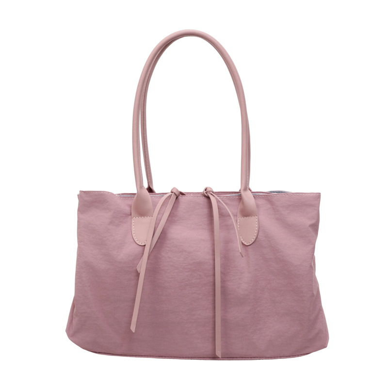 2026 nuevo paquete de moda de tela de alta capacidad, bolso de hombro de alta calidad, bolso de bolsillo pequeño y multifuncional.