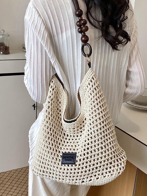 Bolsas de gran capacidad de tejido hueco para mujeres 2026 nuevas bolsas de playa de vacaciones en la playa de viaje nicho brazo Tote image 1