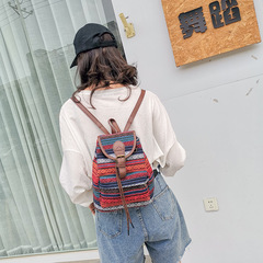 小眾復古抽帶水桶包新款民族風條紋百搭女式休閒背包大容量雙肩包