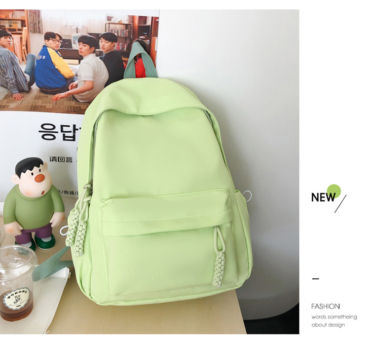 Al por mayor nueva pequeña mochila fresca color caramelo simple de gran capacidad mochila de estudiantes mochila de viaje de ocio