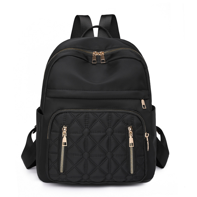 Comercio exterior al por mayor 2023 nueva versión coreana de la mochila de nailon para mujer, línea de bordado de moda, mochila de viaje al aire libre de todo fósforo, marea