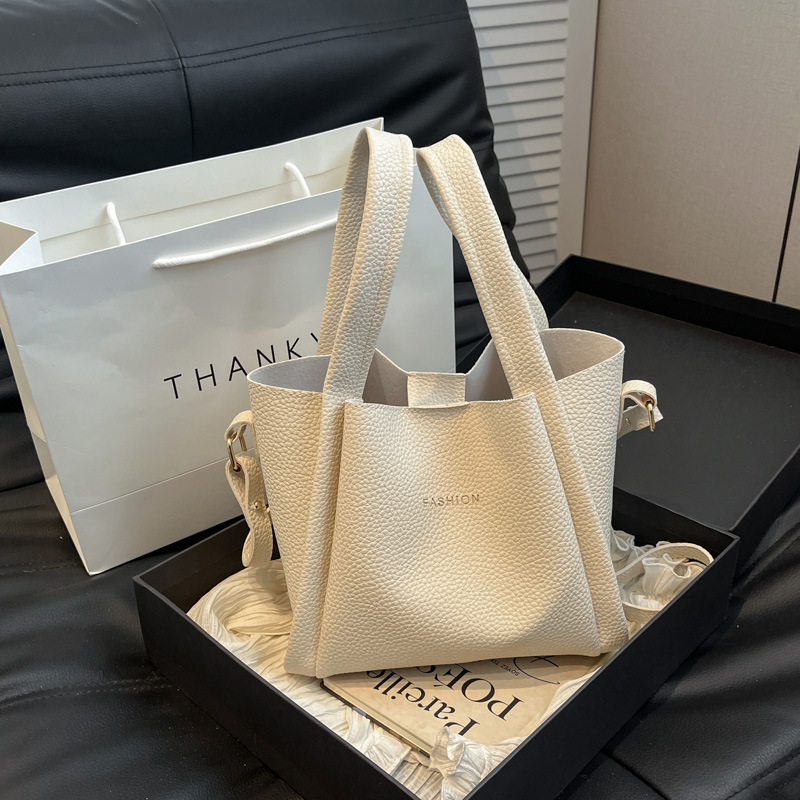 Conjunto de dos bolsos de mujer, primavera 2025, bolso de hombro de cuero suave, bolso bandolera informal y sencillo, popular este año.