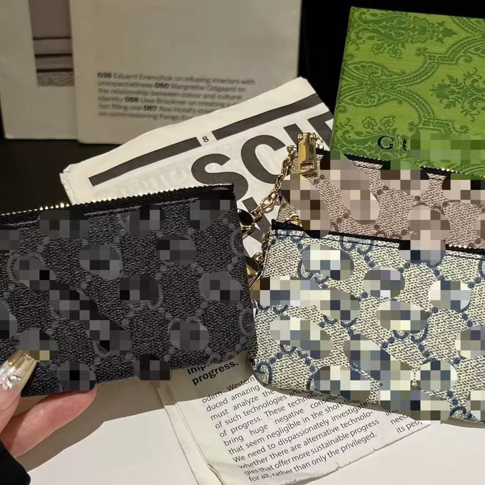 Fabricantes lotes de bolsas de cambio bolsas de lápiz labial bolsas de llaves colgantes bolsas de tarjetas de moda europeas y estadounidenses colgantes abejas GG