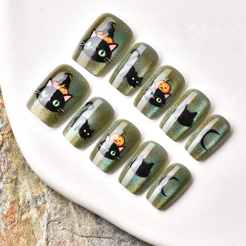 Short Trapezoid Nails with Green Cat-Eye Effect, Cute Pet-Themed Pumpkin and Little Black Cat Halloween Nail Art Pieces