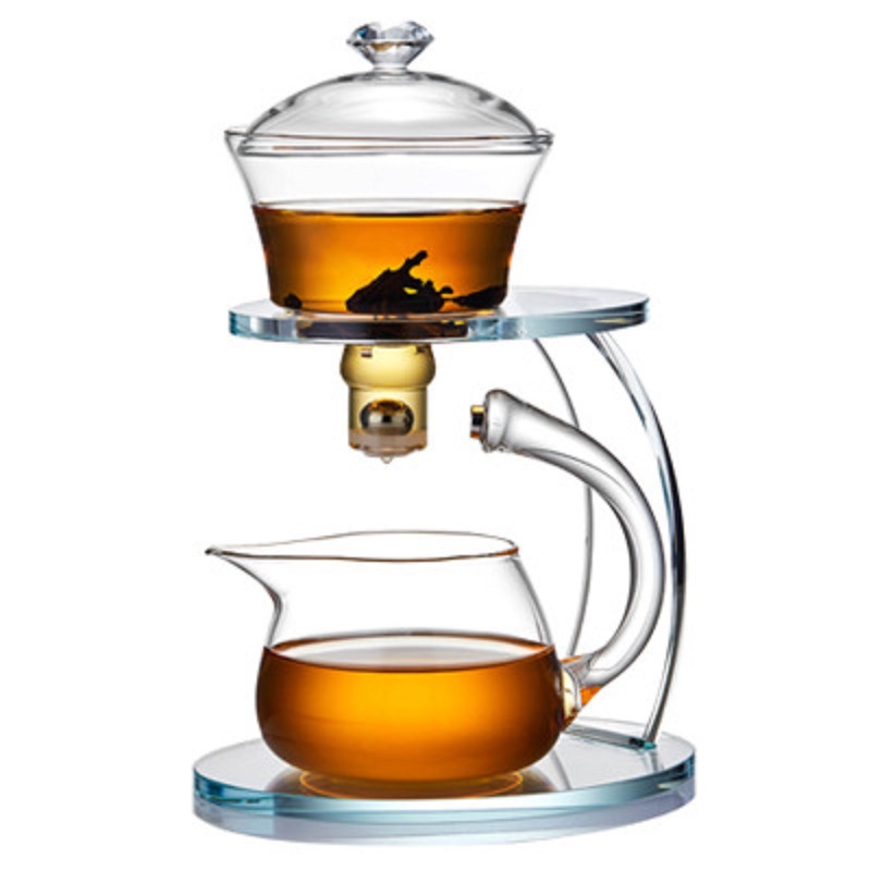 Fábrica al por mayor de vidrio resistente al calor taza de té perezoso traje hogar Kung Fu juego de té engrosada tetera de succión magnética Fabricación de té automática