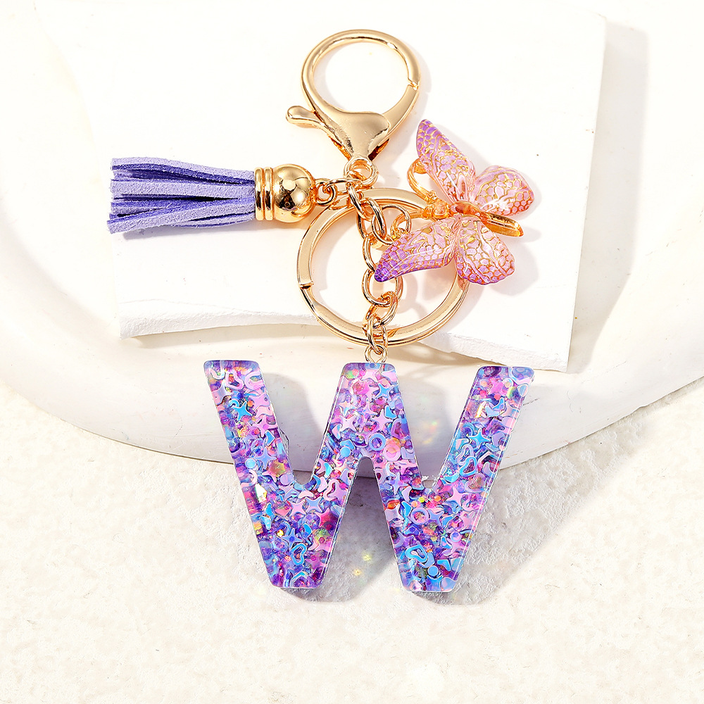 Mayorista transfronterizo mariposa esquinilla iniciales llavero de cristal goteo llavero de letras bolsos colgante