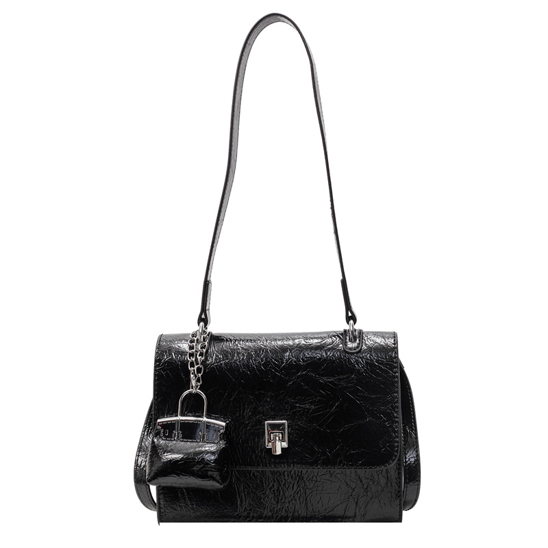 Bolso de textura transfronteriza 2025 primavera y verano nuevo bolso femenino bolso de hombro con patrón de agarre de mano de alta gama bolso de mensajero simple y versátil