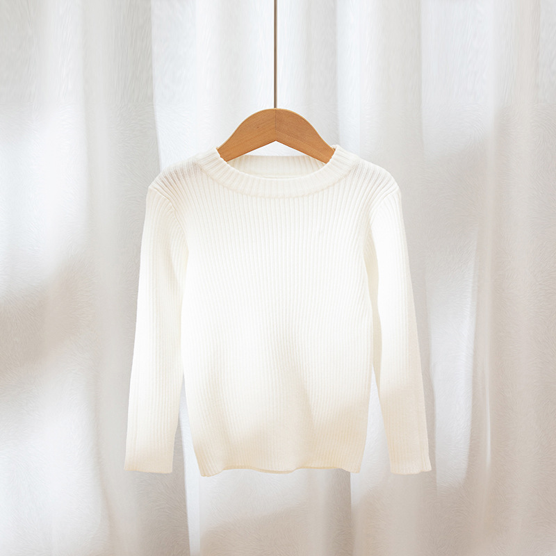 Suéteres infantiles 2025, nuevo estilo de otoño e invierno, ropa interior de punto para niños y niñas, suéter de cuello redondo versátil de color liso.