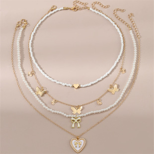 Cross-border new jewelry cute white beige pearl beaded butterfly love pendant children's 4-piece combination suit