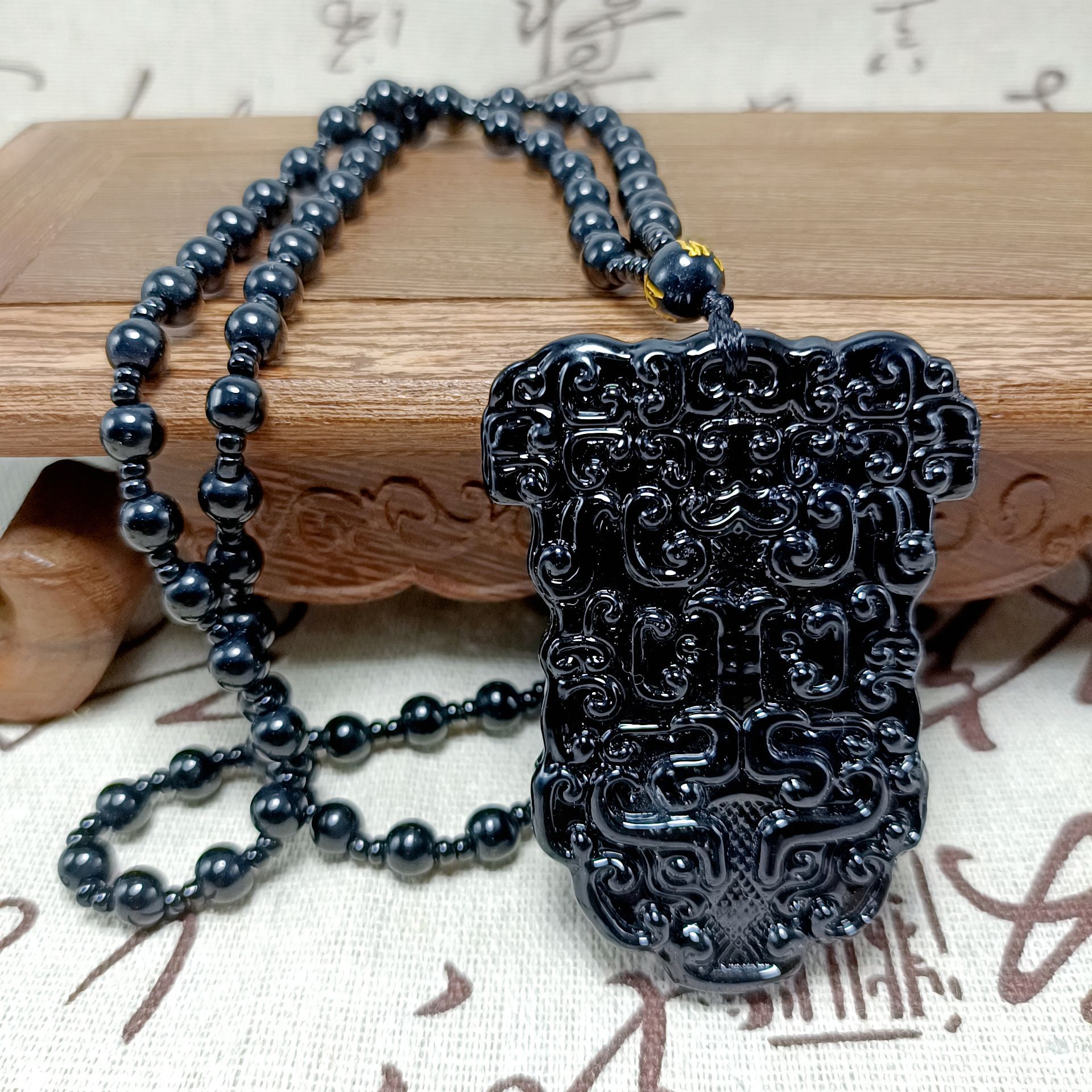 Imitation obsidian glass pendant ink jade jade double-sided gluttonous animal face no matter brand male pendant gift manufacturers wholesale