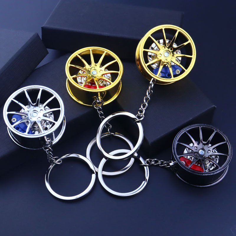 Metal brake wheel hub rotating one gun black key pendant holiday gift Mercedes-Benz wheel hub caliper keychain