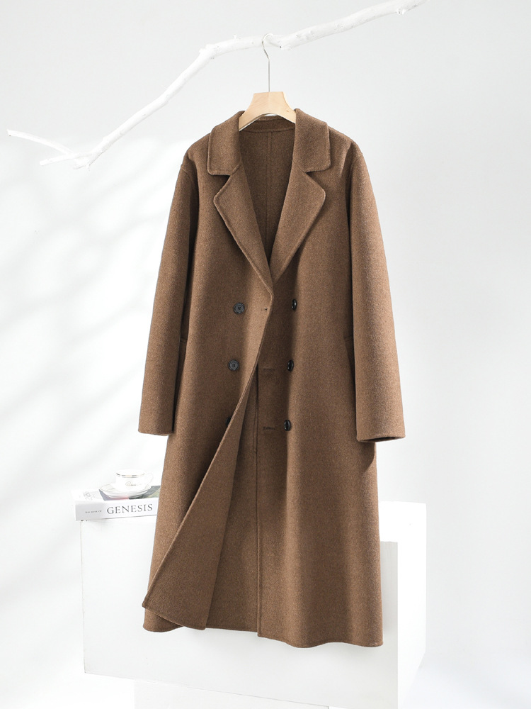 秋冬の長いタイプの膝の両面のカシミヤのコートの男性の双列は韓国版のスーツのゆったりしているウールのフードのコートを掛けます。