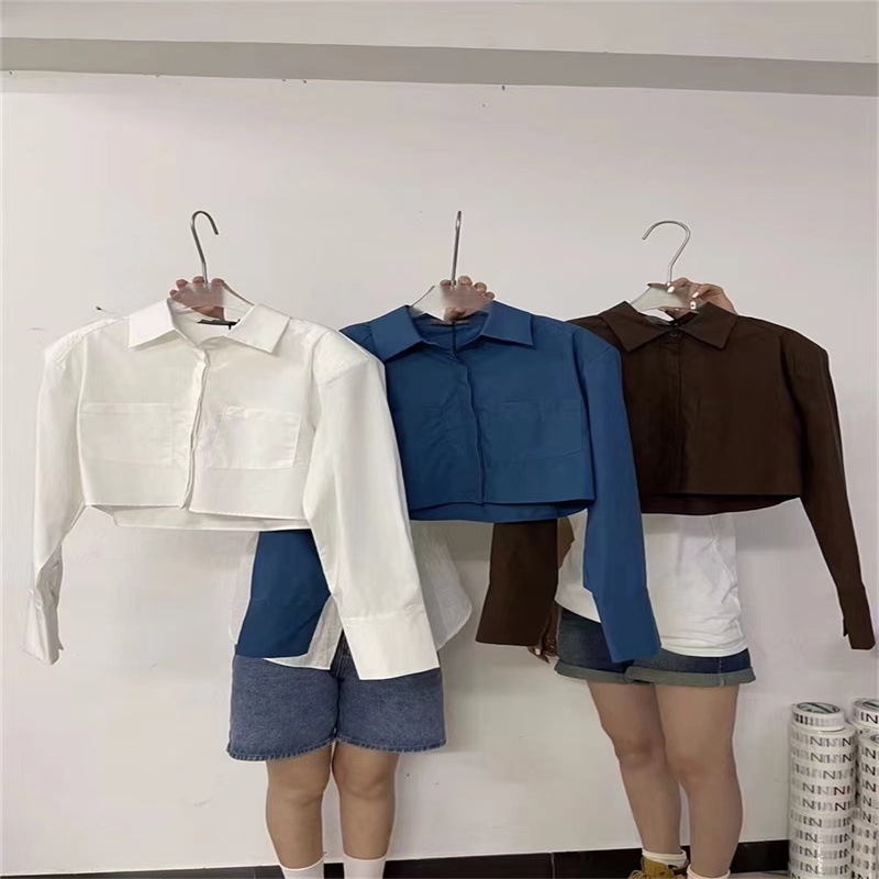 Nueva camisa de manga larga corta de color sólido de estilo coreano para niñas 2023 camisa suelta de bolsillo de solapa para niños medianos y grandes