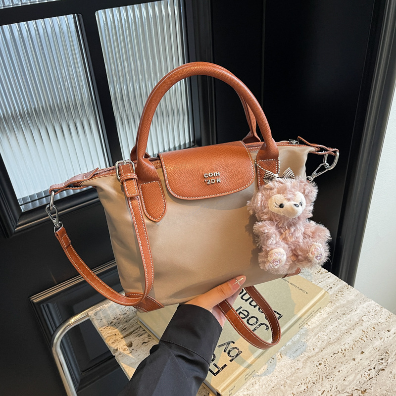 Nylon color contrastante empalme bolso de bolsillo portátil mujer 2024 nuevo estilo transfronterizo de alta calidad exquisita mochila de hombro