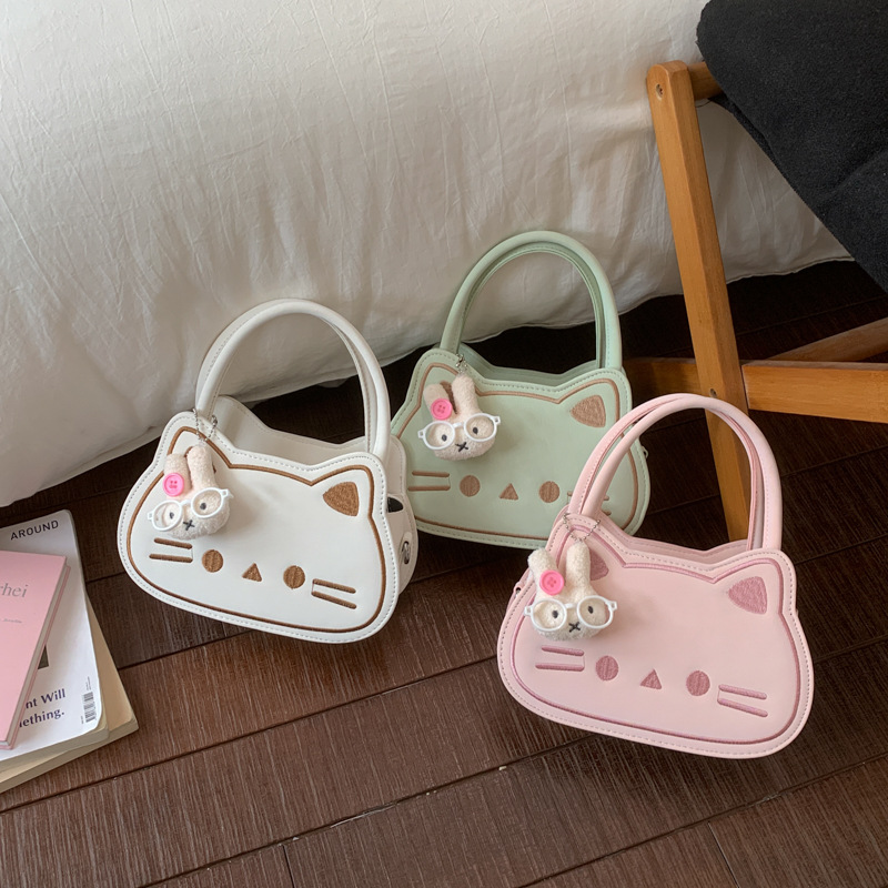 Diseño de nicho de dibujos animados pequeño bolso cuadrado adorable gato leche Hoh Hoh bolso de niña de moda de viaje de hombro mochila