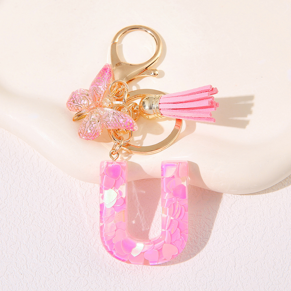 Nuevo rosa damas letras A-Z llavero de goteo de goma sequilla amor letras bordas mariposa llavero transfronterizo