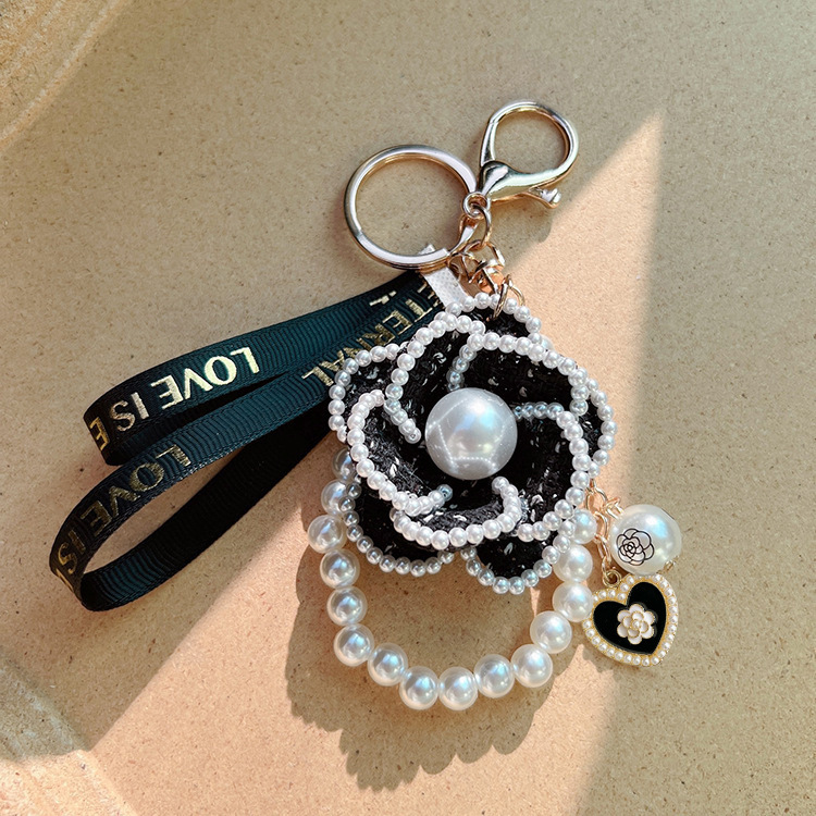 Korean version of the Pearl element Camellia keychain bag pendant creative independent design cross-border supply factory goods Korean version of the Pearl element Camellia keychain bag pendant creative independent design cross-border supply factory goods