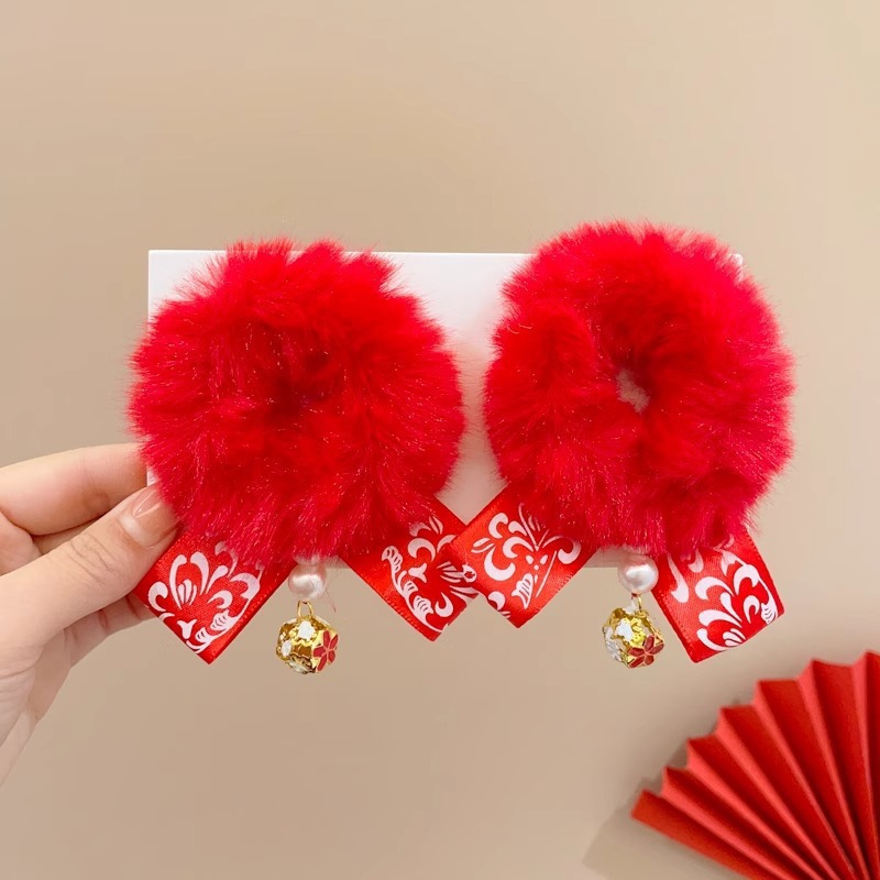 13 cabellos rojos con borlas