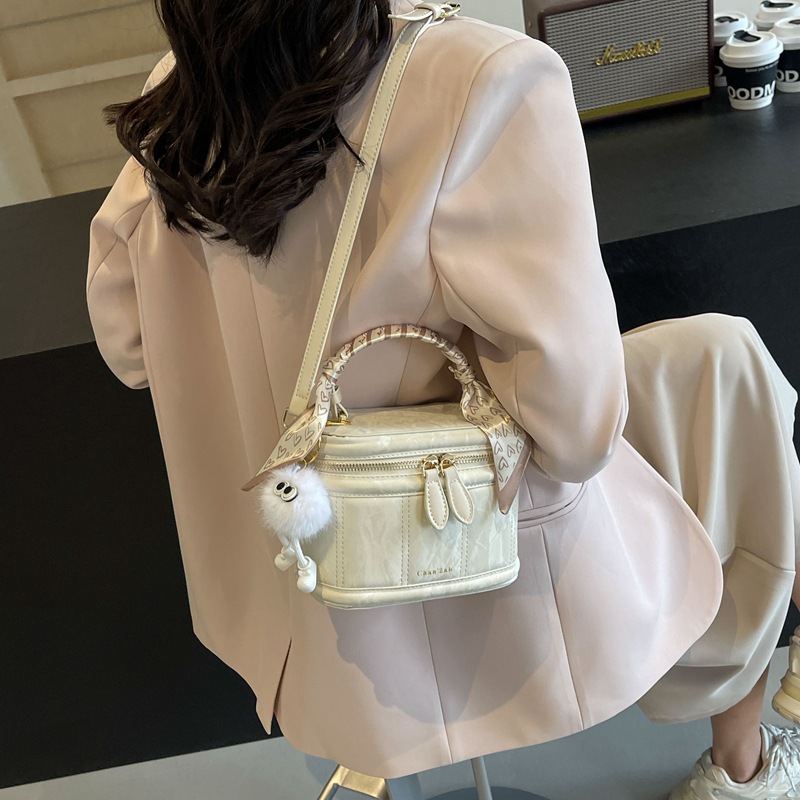 Bolsos versátiles sencillos de alta calidad para mujeres 2026 primavera y verano nuevo nicho bolso de cubo de diseño coreano bolso de hombro