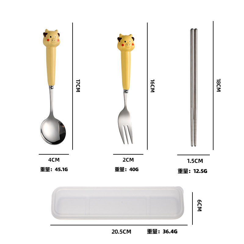 작은 노란색 소 포크, 숟가락 및 젓가락 세트