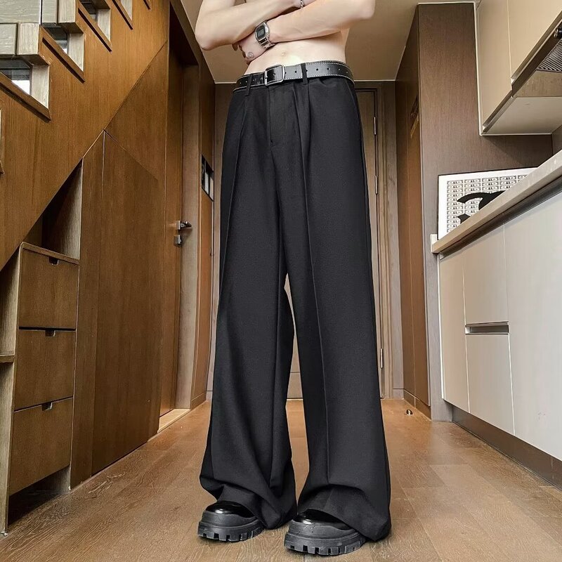 Black slim-fit drapey men's trousers, wrinkle-free, wide-leg, loose-fitting, straight-cut, slightly flared, elegant style suit pants