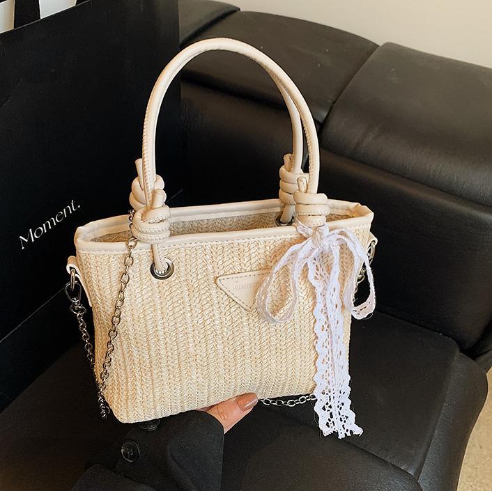 Bolsa de balde de mano de verano explosivo 2025, nueva bolsa de paja de vacaciones en la playa para viajar al trabajo, bolsa de hombro de alta calidad