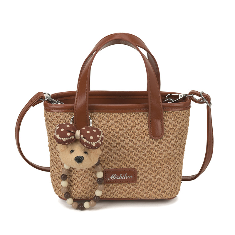 Bolsa de playa de moda coreana tejida, color extranjero, bolsa de hombro ligera y compacta para niños y niñas, nueva bolsa infantil transfronteriza.