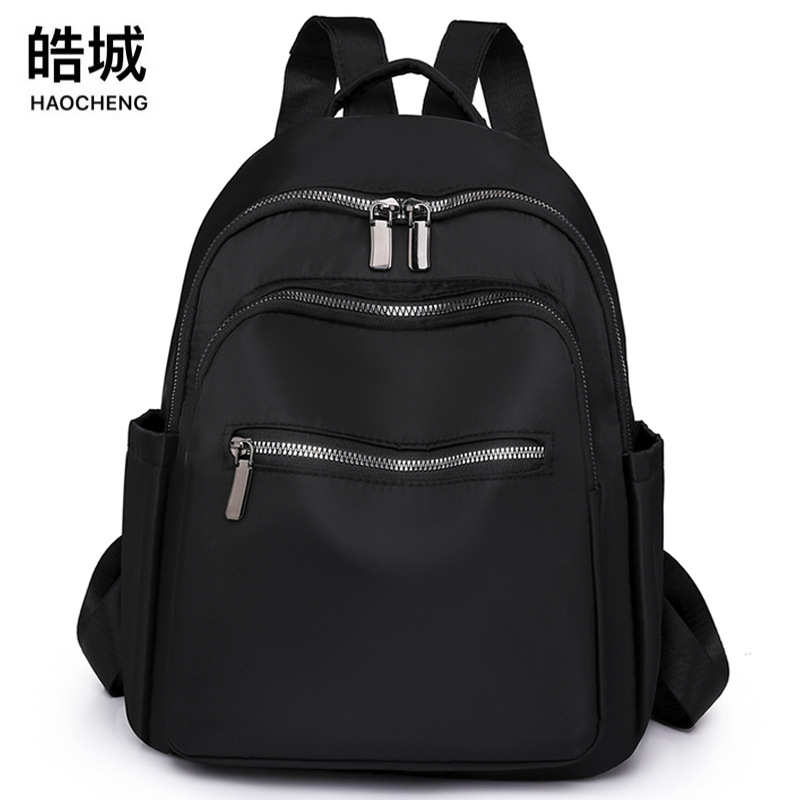 2023 nueva mochila de tela Oxford de color sólido para mujer, arte urbano, viajero, mochila de viaje ligera, mochila escolar al por mayor