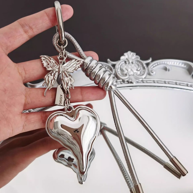 ニッチインスタイルデザイン、新鮮でシンプルなリボンラブバッグペンダント、編み込みロープアクセサリーキーホルダー卸売|undefined