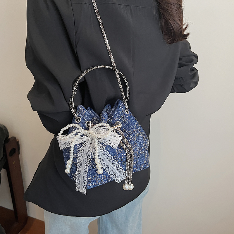Verano popular taladro caliente bolso de cubo de mano mujer 2025 nuevo estilo coreano denim casual mochila para trabajar