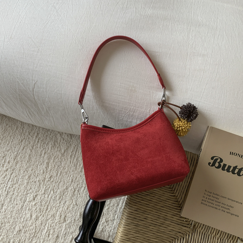 Transfronterizos retro gamuz bolsas portátiles bajo las axilas mujeres 2025 otoño y invierno nueva moda coreana de viaje al trabajo bolsas de hombro inclinadas