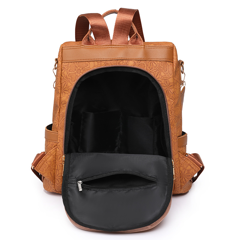 Spot al por mayor 2023 nueva mochila antirrobo de cuero suave para mujer, mochila multifuncional en relieve de color de contraste simple, mochila escolar